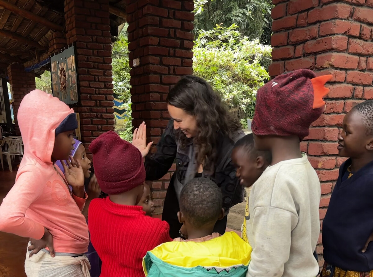 Ellen playing a game with students in Tanzania